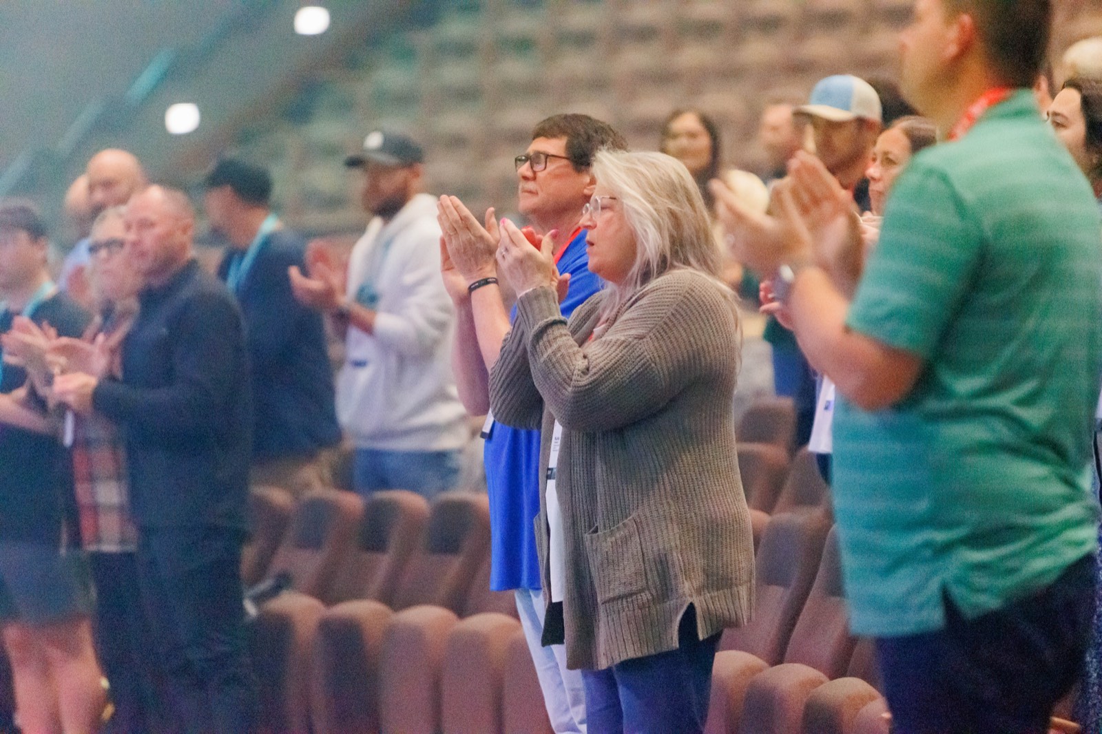 Leaders standing and applauding in the auditorium at the Intentional Churches Conference