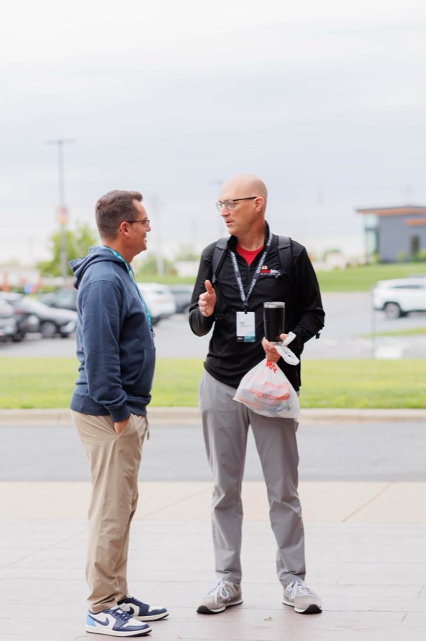 Two leaders talking outside the venue