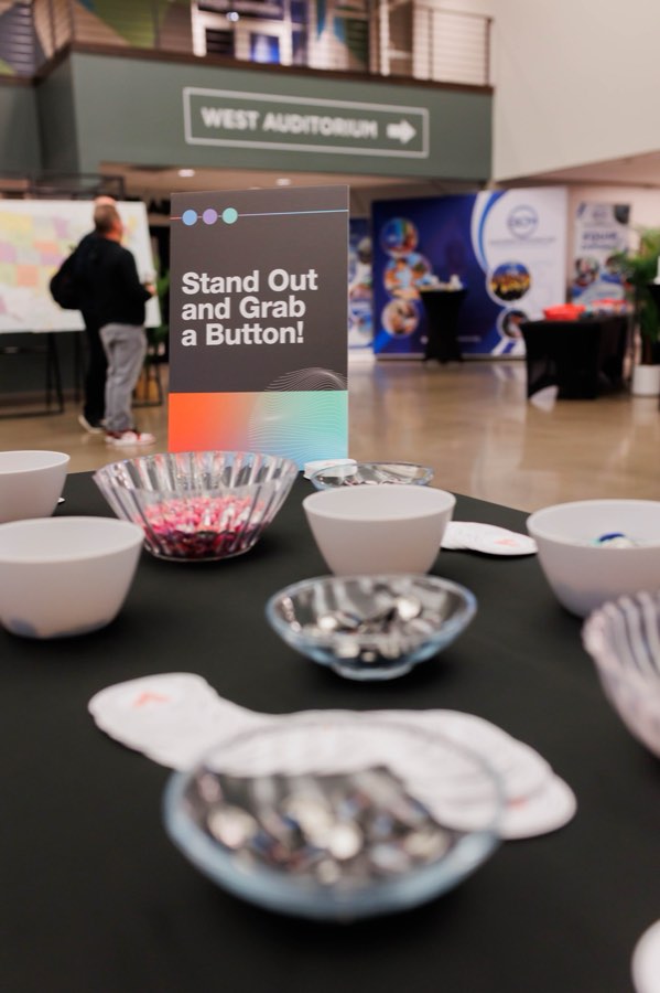 Stand Out and Grab a Button table in the lobby