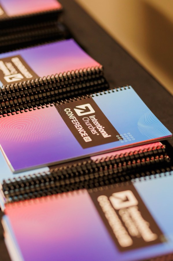 Stacked Intentional Churches Conference notebooks